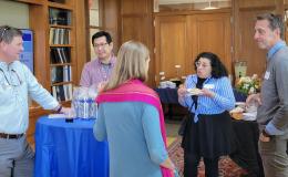 SSRI cofunded faculty members mingling and chatting.
