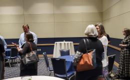Attendees from the IFSE Workshop enjoy a reception.
