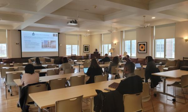 Jenny Van Hook presents about working with the Russell Sage Foundation to a room of attendees.