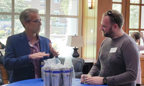 SSRI cofunded faculty members mingling and chatting.