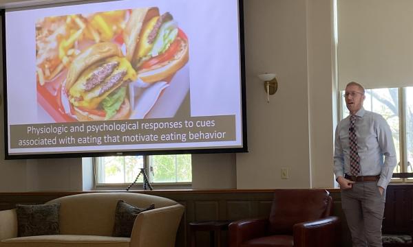 Travis Masterson presenting his Powerpoint presentation.