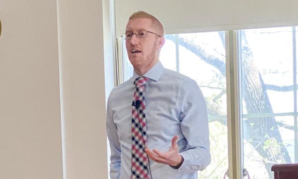 Travis Masterson presenting his Powerpoint presentation.