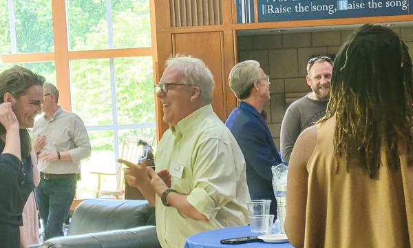 CSUA Director, Paul Griffin, chatting with other cofunded faculty members.