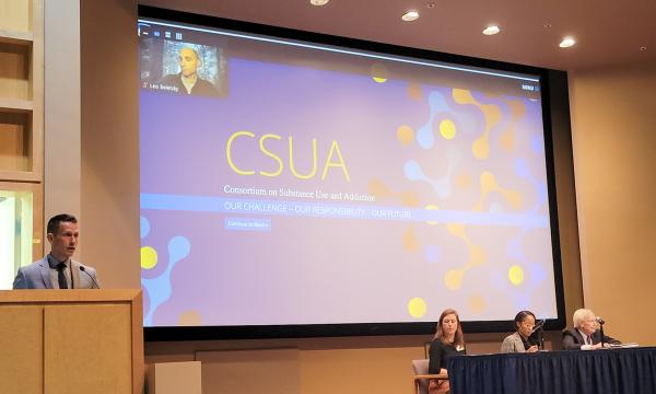 Glenn Sterner moderates a panel about the opioid settlement trust.