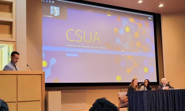 Glenn Sterner moderates a panel about the opioid settlement trust.