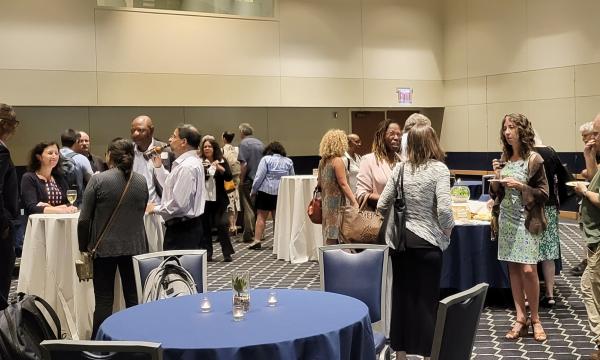 Attendees of the IFSE workshop gather for a reception after the presentations and workshops.