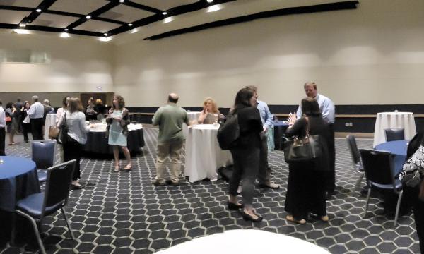 Attendees from the IFSE Workshop enjoy a reception.