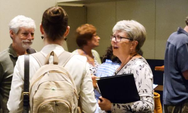 Attendees from the IFSE Workshop enjoy a reception.