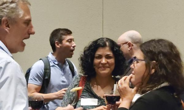 Attendees from the IFSE Workshop enjoy a reception.