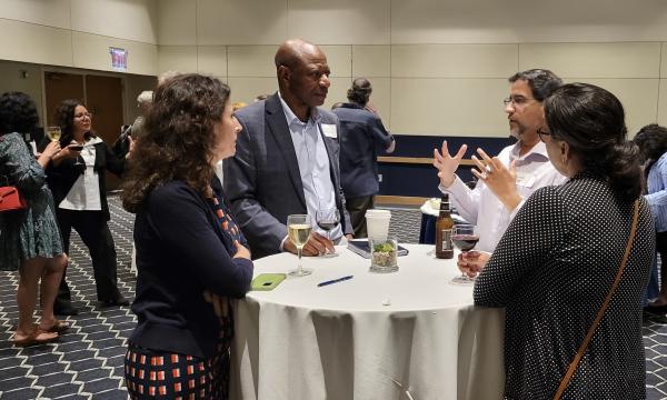 Attendees from the IFSE Workshop enjoy a reception.