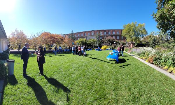 SSRI staff prepare for the Fall Welcome Event in front of the Hintz Alumni Center.