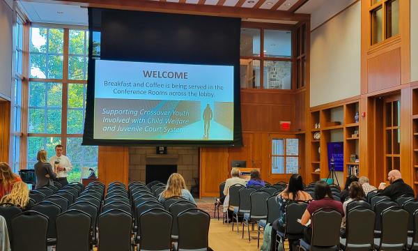 Wide shot of the attendees of the Child Maltreatment Solutions Network Conference.