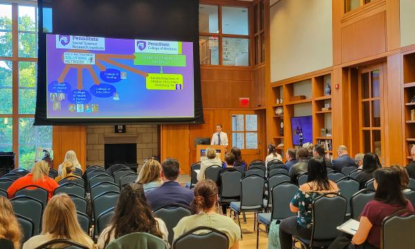 Wide shot of the attendees of the Child Maltreatment Solutions Network Conference.