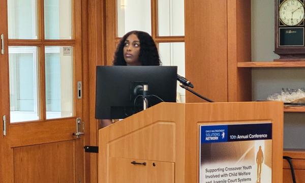 Amiyah Davis stands at the podium.