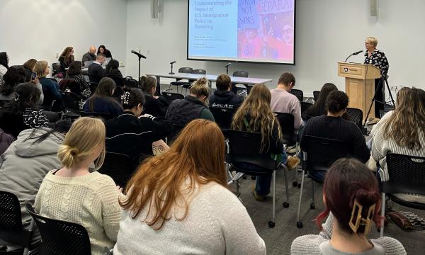 Group of students and faculty attend the 31st Annual Family Symposium.