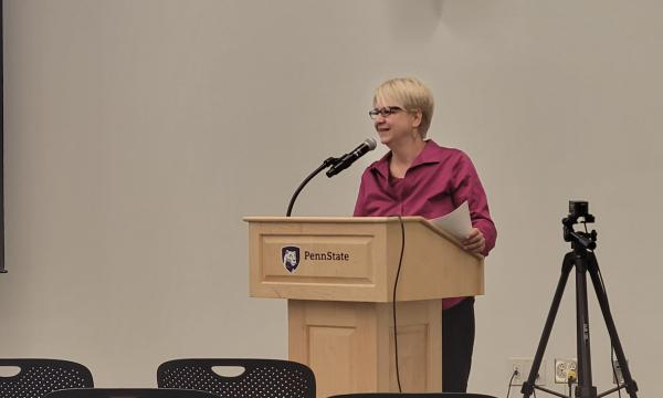 Jenny Van Hook addresses the attendees and introduces the first speaker for Tuesday's session.