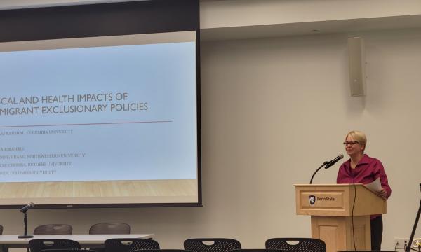 Jenny Van Hook addresses the attendees and introduces the first speaker for Tuesday's session.