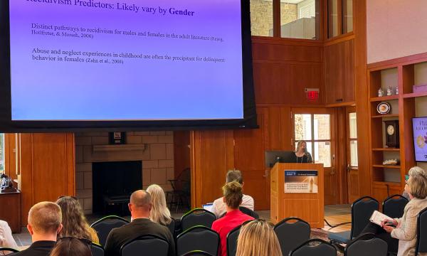 Allison Kurpiel presents about rates and predictors of juvenile recidivism for child welfare involved youth.