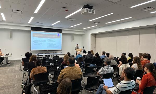 Photo of Audrey Dorélien presenting to De Jong Lecture attendees.