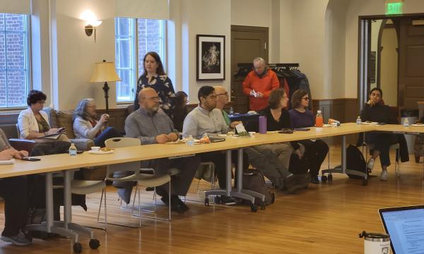 Attendees gather in the 110 Henderson Building Living Center.