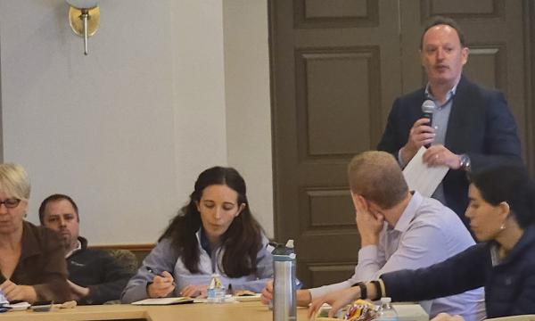Brian King talks to attendees about new climate science efforts.