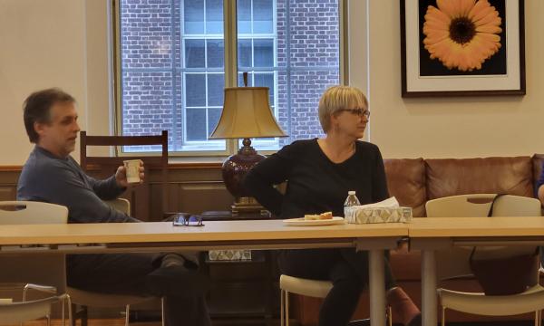 SSRI Open House panelists Marty Sliwinski, a white man in a blue sweater, Jenny Van Hook, a white woman with short, blonde hair, and Stephanie Lanza, a white woman with glasses and a dark colored shirt, talk to the group.