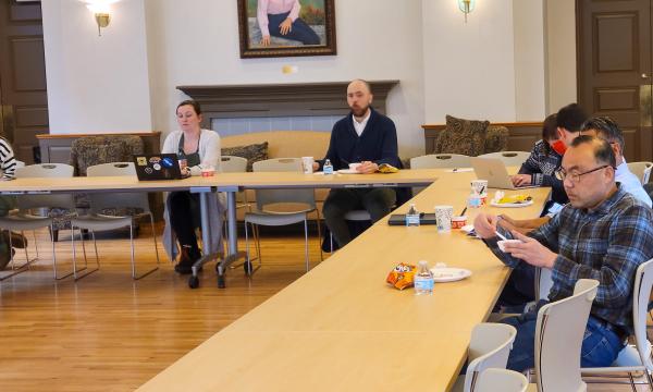 Attendees listen to a presentation about the Penn State Cancer Institute.