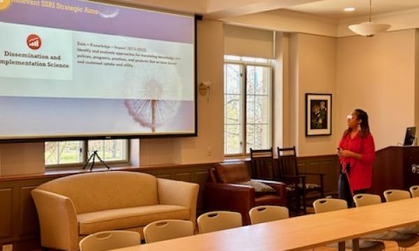 Amy Snipes, SSRI associate director, presenting about community engagement. 