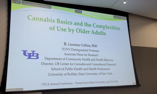 PowerPoint slide on a large screen that says: Cannabis Basics and the Complexities of Use by Older Adults.