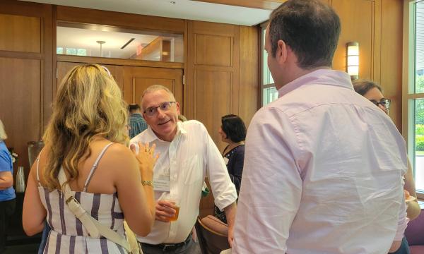 Attendees of the annual SSRI Spring Celebration gather in the Hintz Alumni Center.