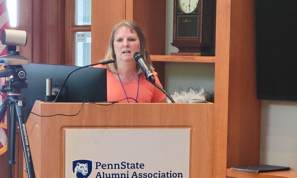 Barbara Rigg, SSRI's Admin Director, addresses the group about SSRI Staff Awards.