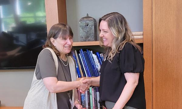 Deborah Ehrenthal, SSRI Director, and Kelly Lingenfelter, Proposal and Award Generalist for PRI, with her Innovation Award.