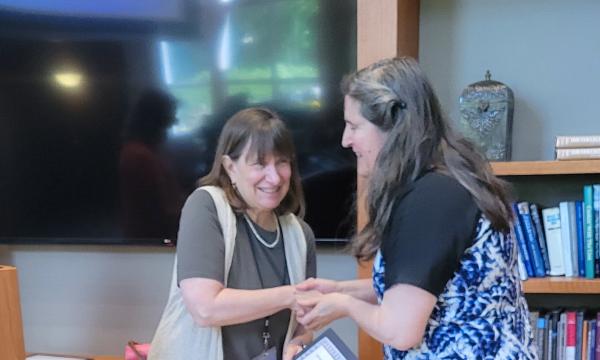 Deborah Ehrenthal, SSRI Director, and Lisa Ryan, Data Compliance Specialist for PRI, with her Diversity and Inclusion Award.
