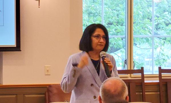 Penn State President Bendapudi talks to the group.