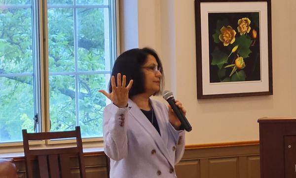 Penn State President Bendapudi talks to the group.