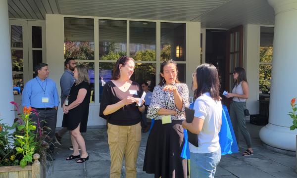 Attendees gathered outside Alumni Hall. 