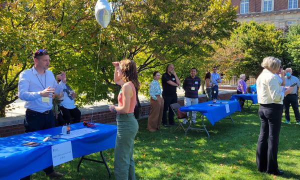 Attendees visit the various carnival-style tables to learn more about SSRI and other outside units.