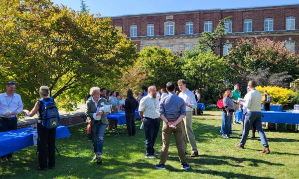 Attendees of the SSRI Fall Welcome event mingling.