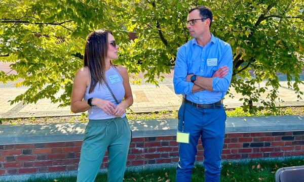 Faculty members chatting.