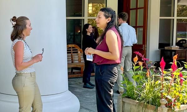 Attendees mingling at on the Alumni Hall lawn.