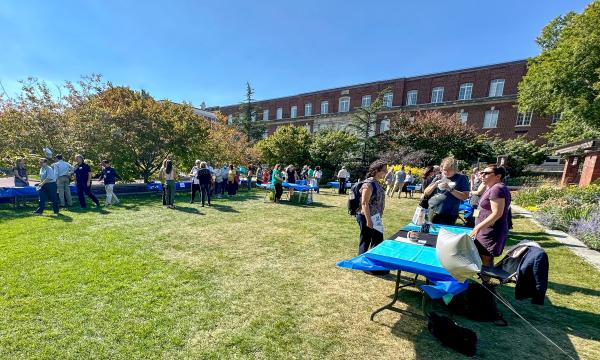 Attendees mingling at on the Alumni Hall lawn.