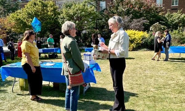 Attendees mingling at on the Alumni Hall lawn.