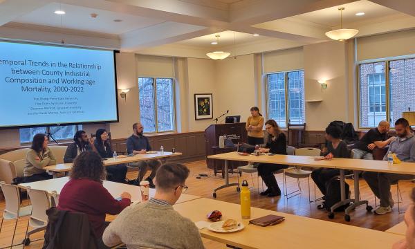 Deborah Ehrenthal, SSRI Director, welcomes attendees to the faculty flash talks open house in 110 Henderson.