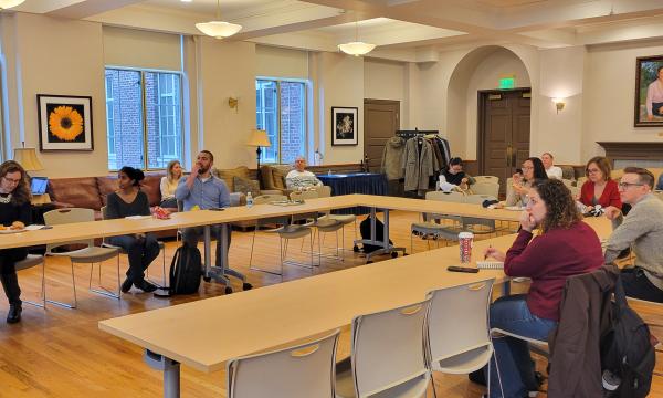 Wide shot of the attendees in 110 Henderson.