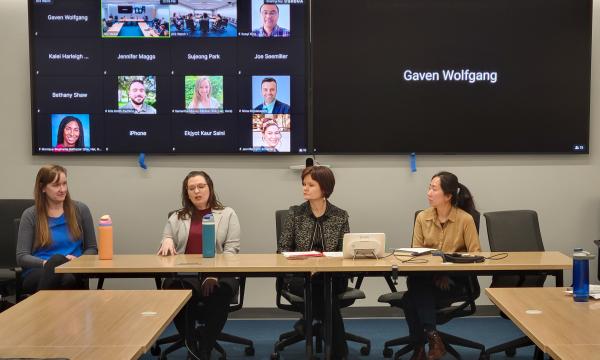 Four women, Jessica Thompson, Kathyrn Risher, Corina Graif, and Thoa Khuu, sit at a table to discuss NIH K awards.