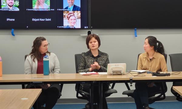 Four women, Jessica Thompson, Kathyrn Risher, Corina Graif, and Thoa Khuu, sit at a table to discuss NIH K awards.