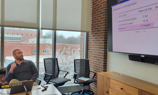 Ryan Thombs, SSRI cofund, presents to the group.
