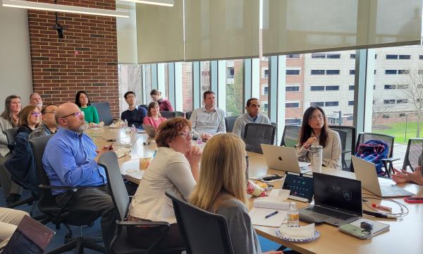 Attendees of the ICDS Open House listen to the presentation in 314 Welch.