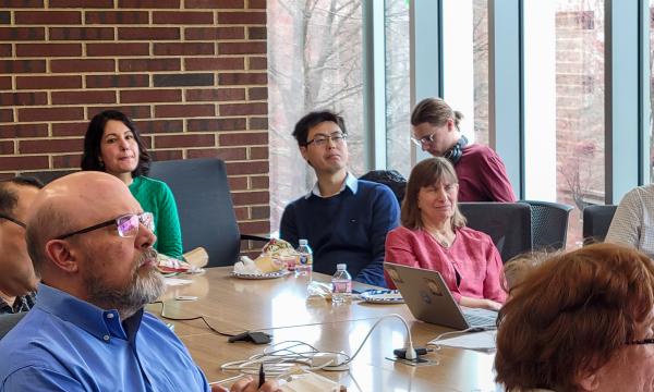 Attendees of the ICDS Open House listen to the presentation in 314 Welch.