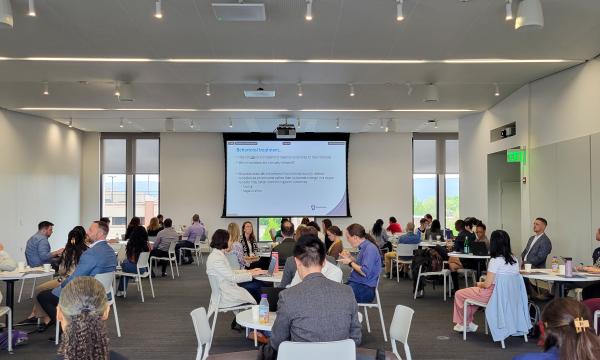 Wide shot of attendees listening to Brad Linn's talk.